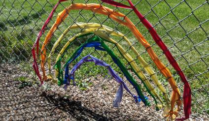 An image of a little rainbow attached to the Primary School fence